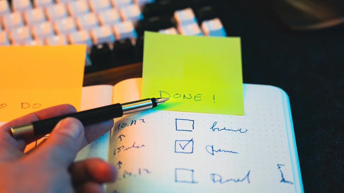 Article Writing SaaS Selection — The Complete Guide Article Writing SaaS Selection — The Complete Guide — Hand Writing in Notebook with Checklist and Sticky Note