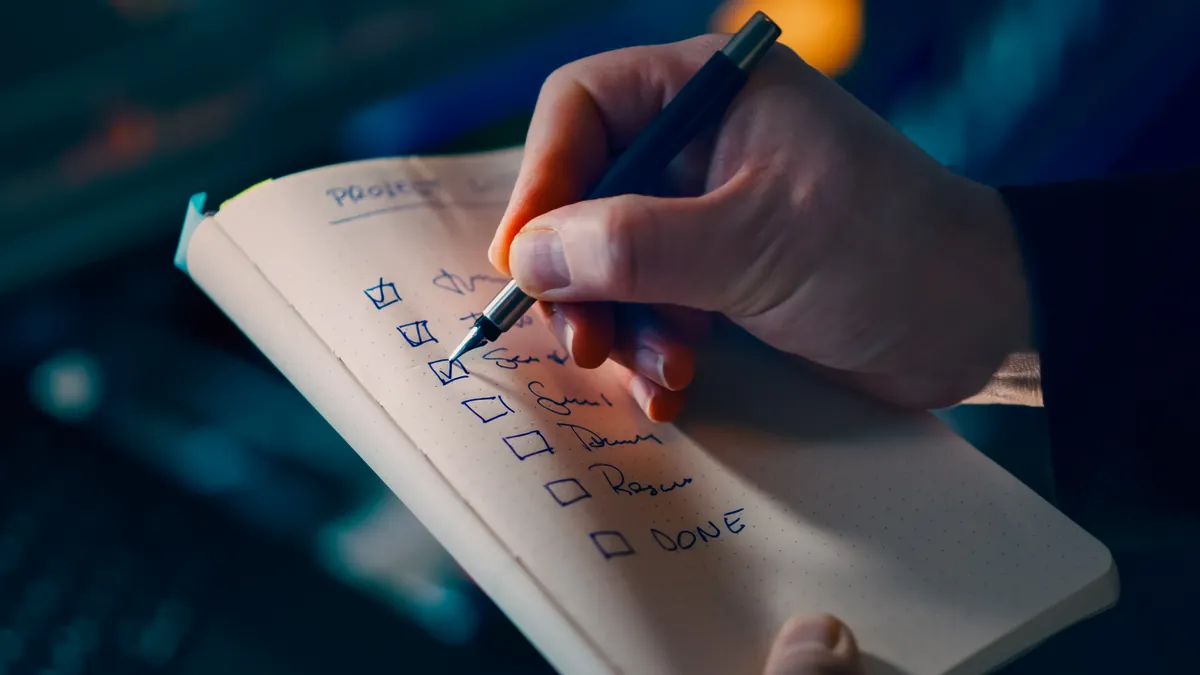 Article Writing SaaS Selection — The Complete Guide Article Writing SaaS Selection — The Complete Guide — Hand Writing on Notebook with Checklist